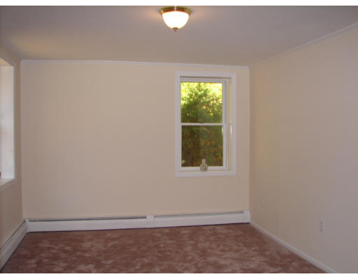 37 Kent Road Westminster, MA 01473 - Photo 8 of 19 a view of an empty room with wooden floor and a window