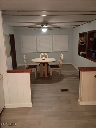 a dinning table and chairs in a room