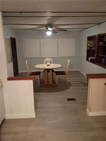 a dinning table and chairs in a room