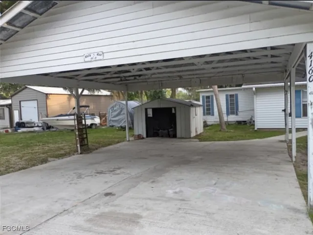 a view of a house with backyard and porch