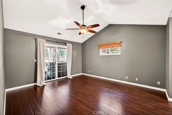 a view of kitchen with stainless steel appliances granite countertop a sink and a refrigerator