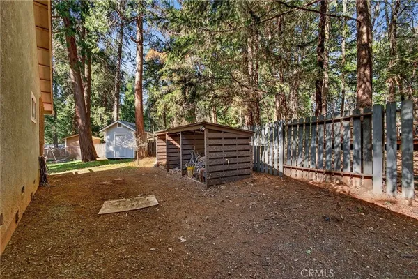 a view of outdoor space with deck and tree