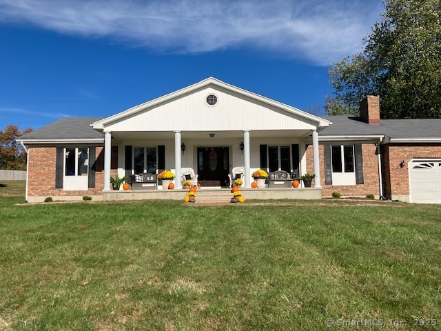 7 Spindle Road Seymour, CT 06483 - Photo 1 of 1 a view of a patio with table and chairs under an umbrella