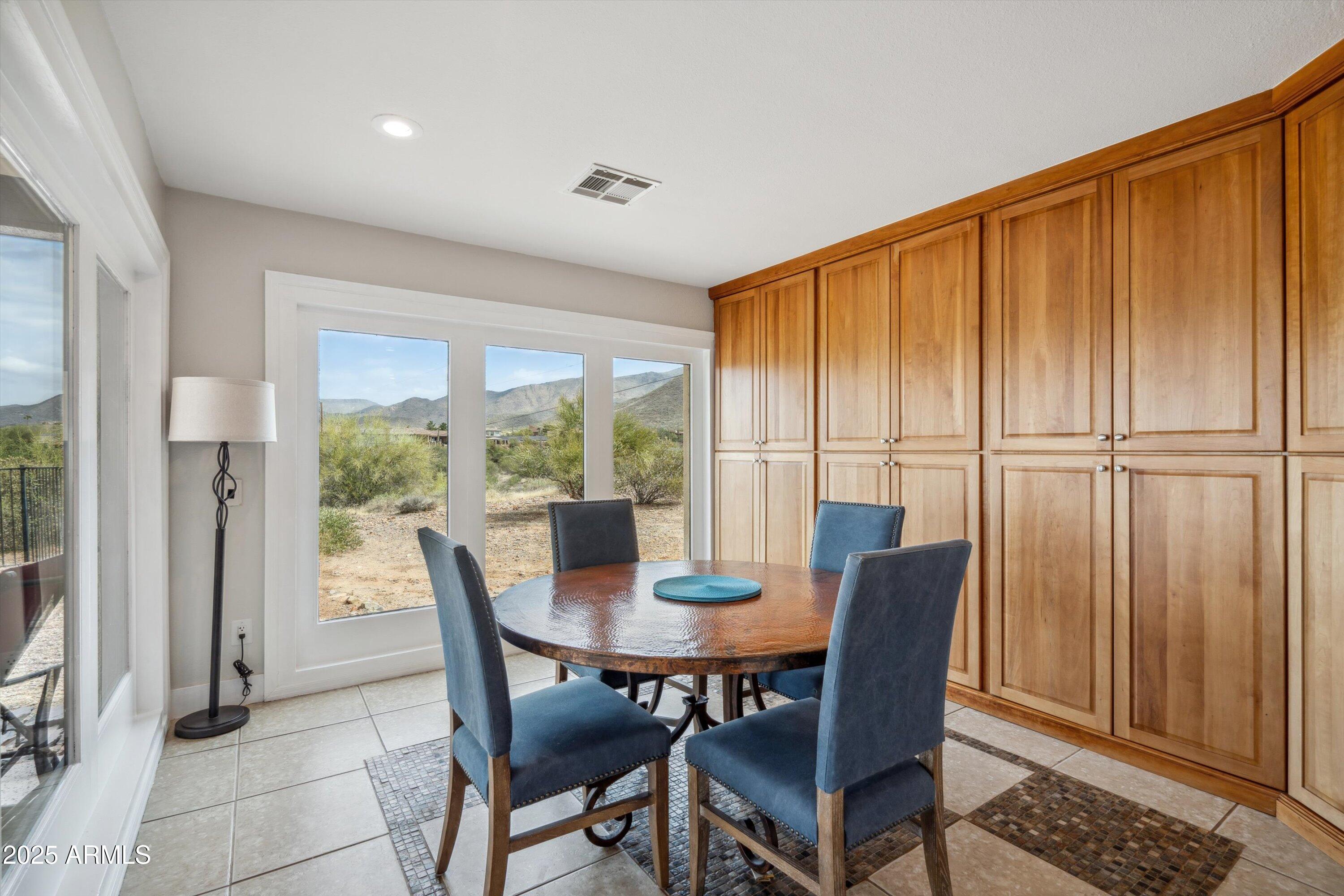 7080 East Arroyo Road Cave Creek, AZ 85331 - Photo 17 of 50 a view of a dining room with furniture window and outside view