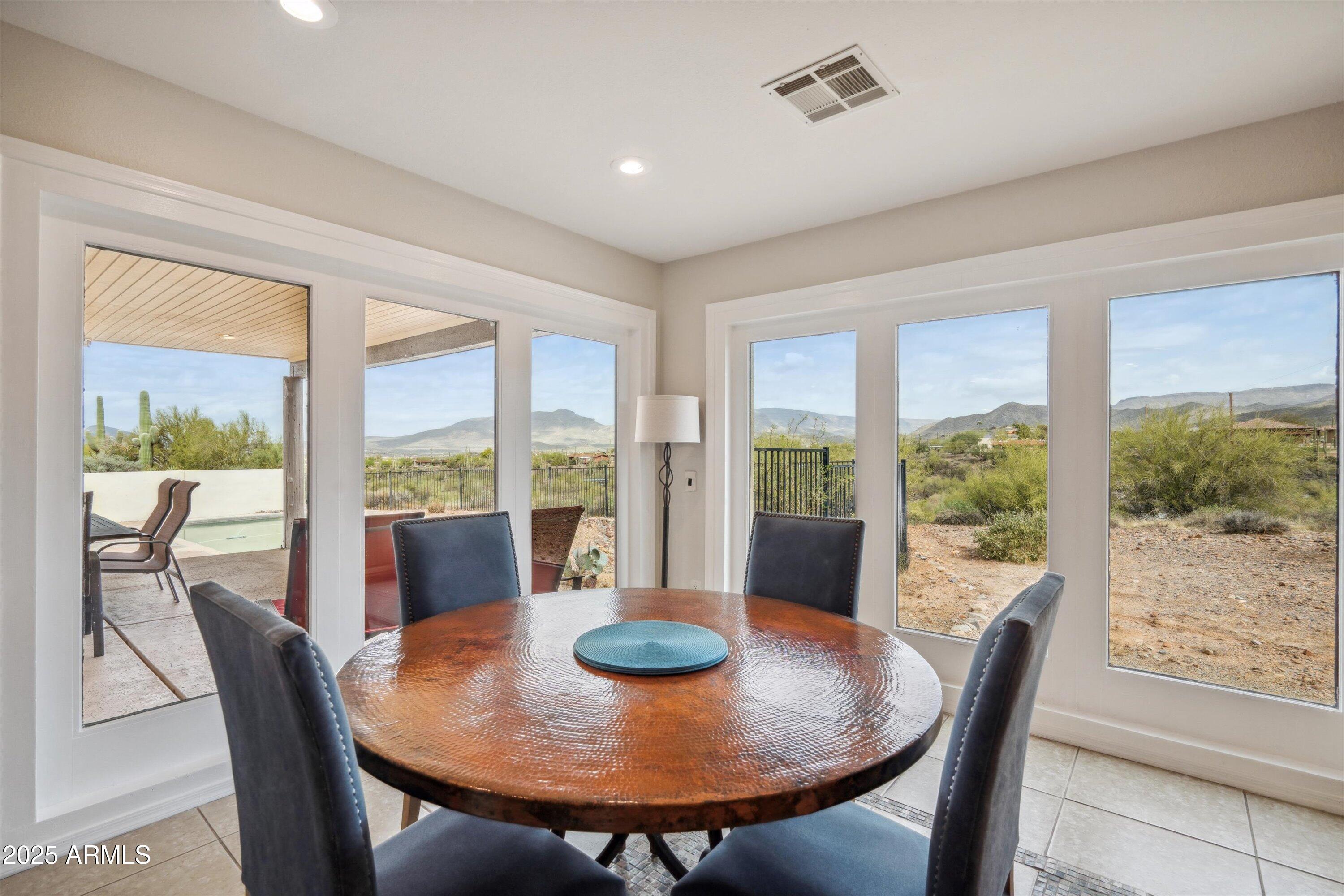 7080 East Arroyo Road Cave Creek, AZ 85331 - Photo 18 of 50 a view of a dining room with furniture window and outside view
