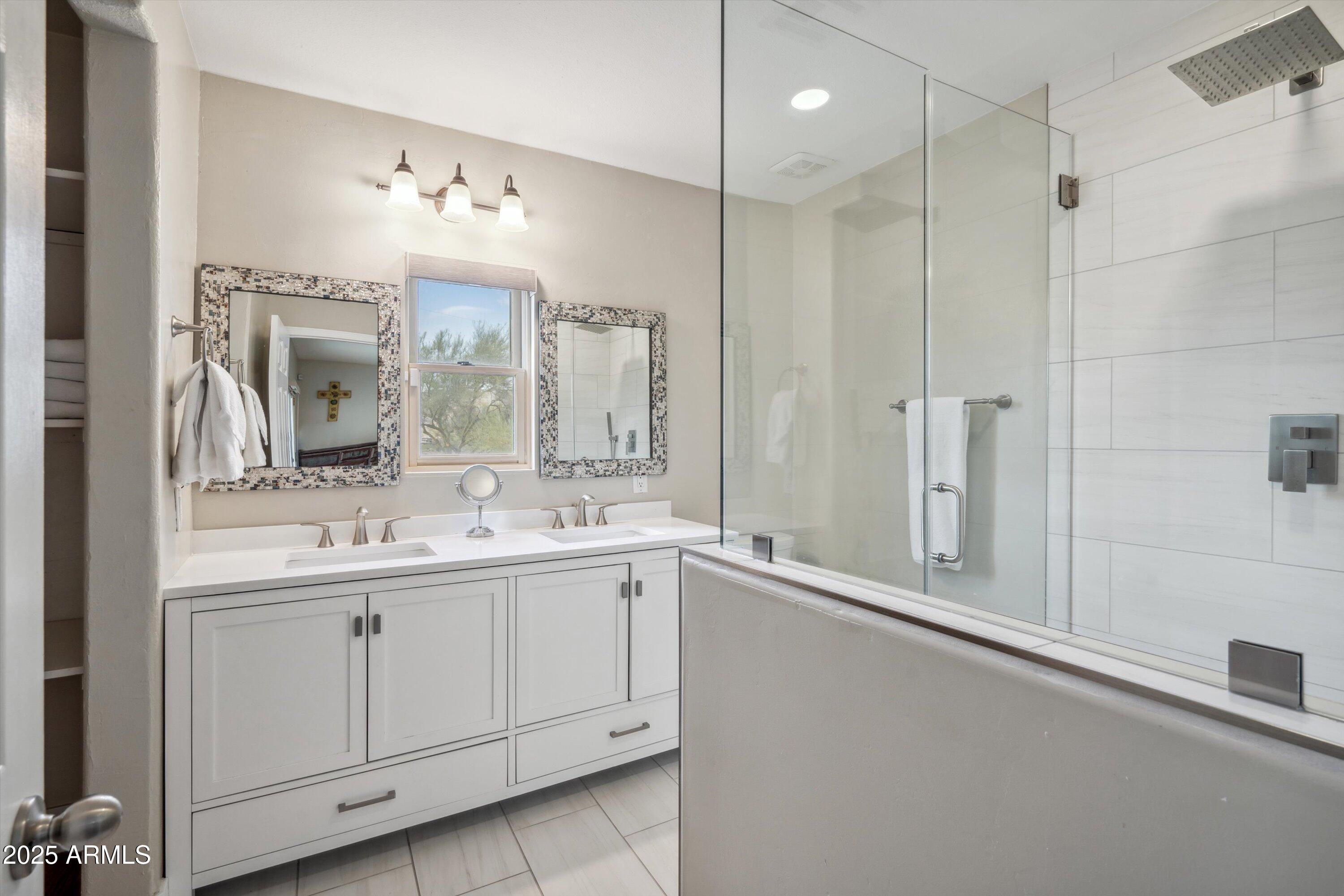 7080 East Arroyo Road Cave Creek, AZ 85331 - Photo 21 of 50 a bathroom with a double vanity sink mirror and double