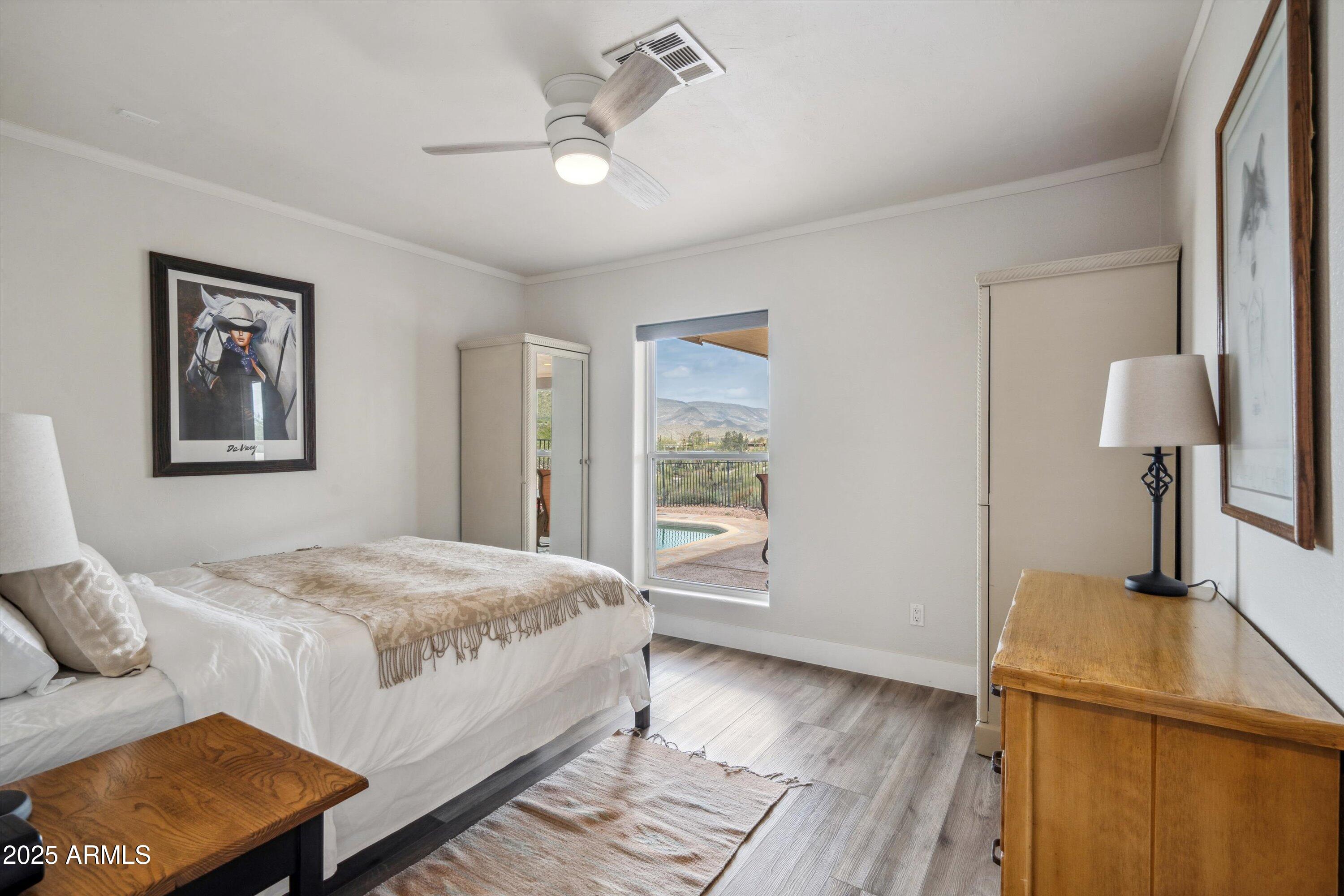 7080 East Arroyo Road Cave Creek, AZ 85331 - Photo 27 of 50 a bedroom with a bed and a window