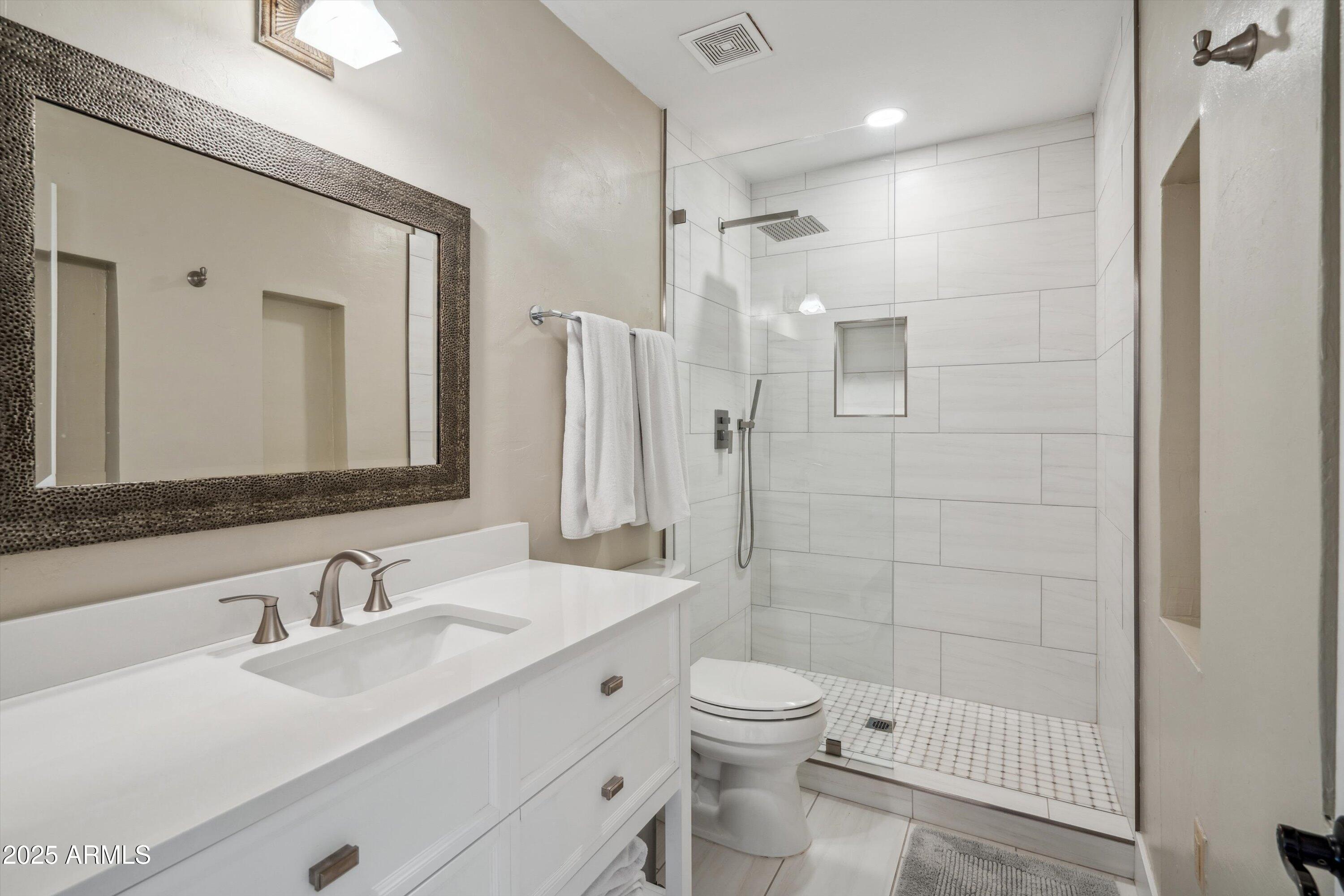 7080 East Arroyo Road Cave Creek, AZ 85331 - Photo 28 of 50 a bathroom with a sink a toilet and shower