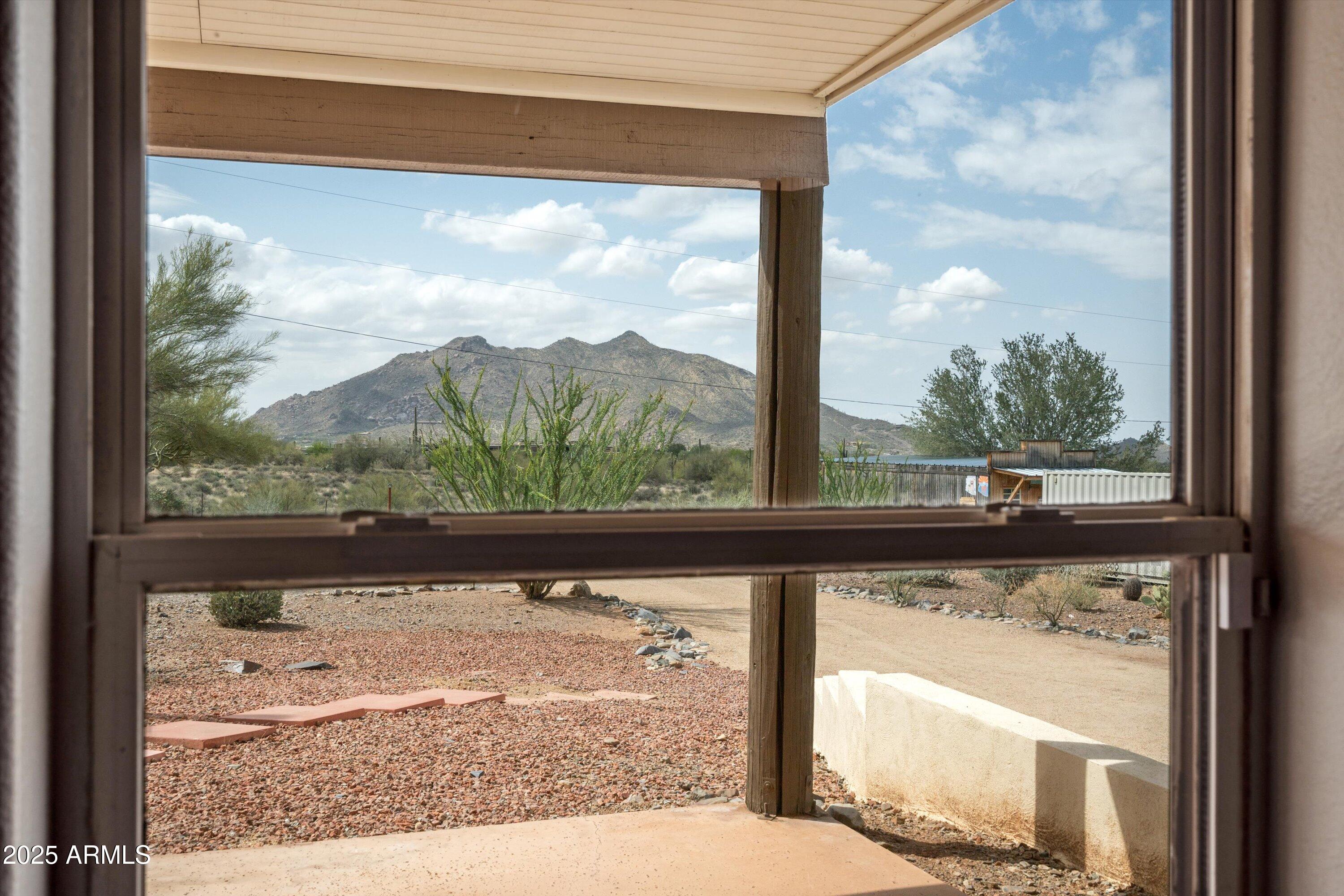 7080 East Arroyo Road Cave Creek, AZ 85331 - Photo 30 of 50 a view of a glass door next to a yard
