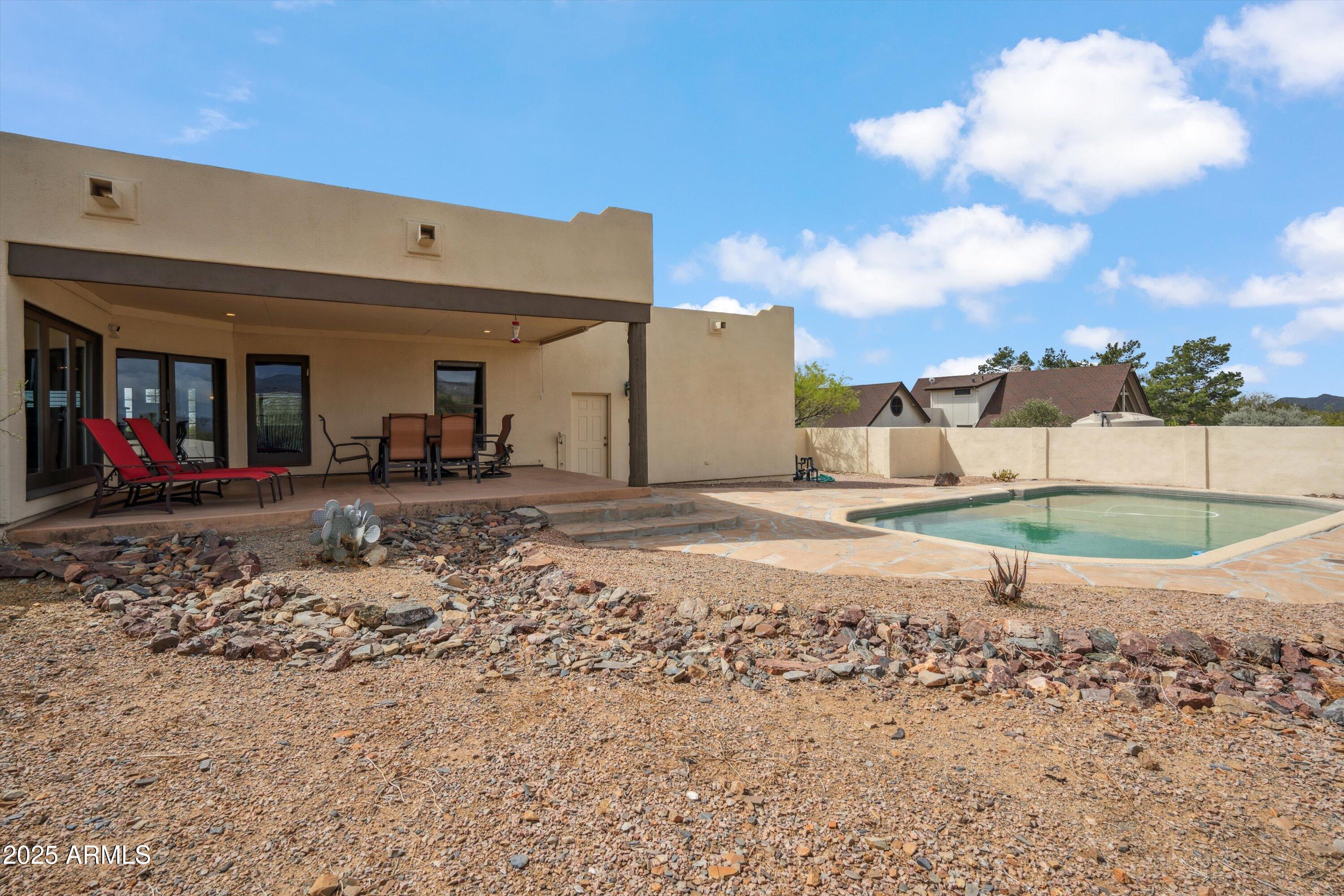 7080 East Arroyo Road Cave Creek, AZ 85331 - Photo 33 of 50 a view of a house with a backyard