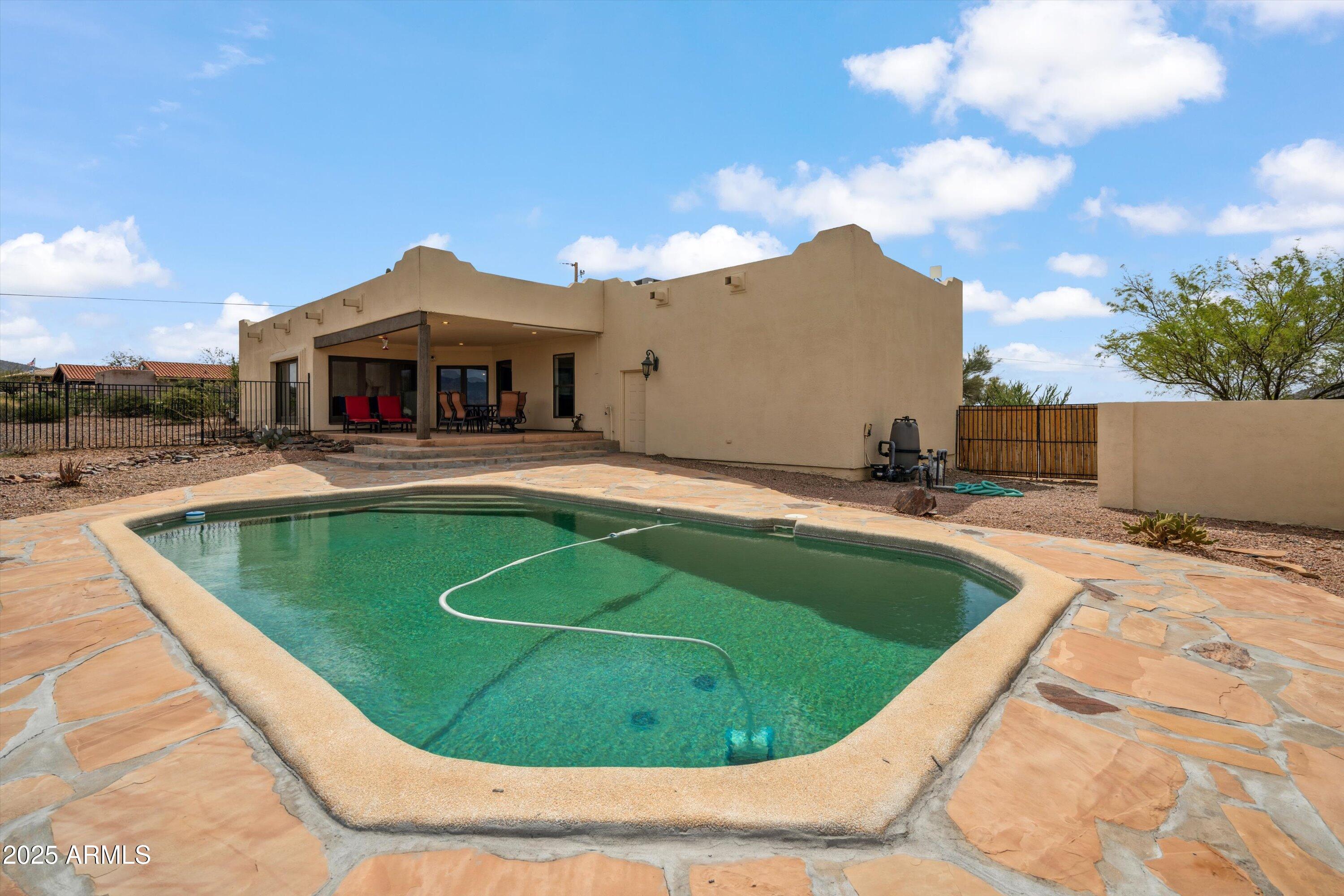 7080 East Arroyo Road Cave Creek, AZ 85331 - Photo 34 of 50 a view of a swimming pool with a yard