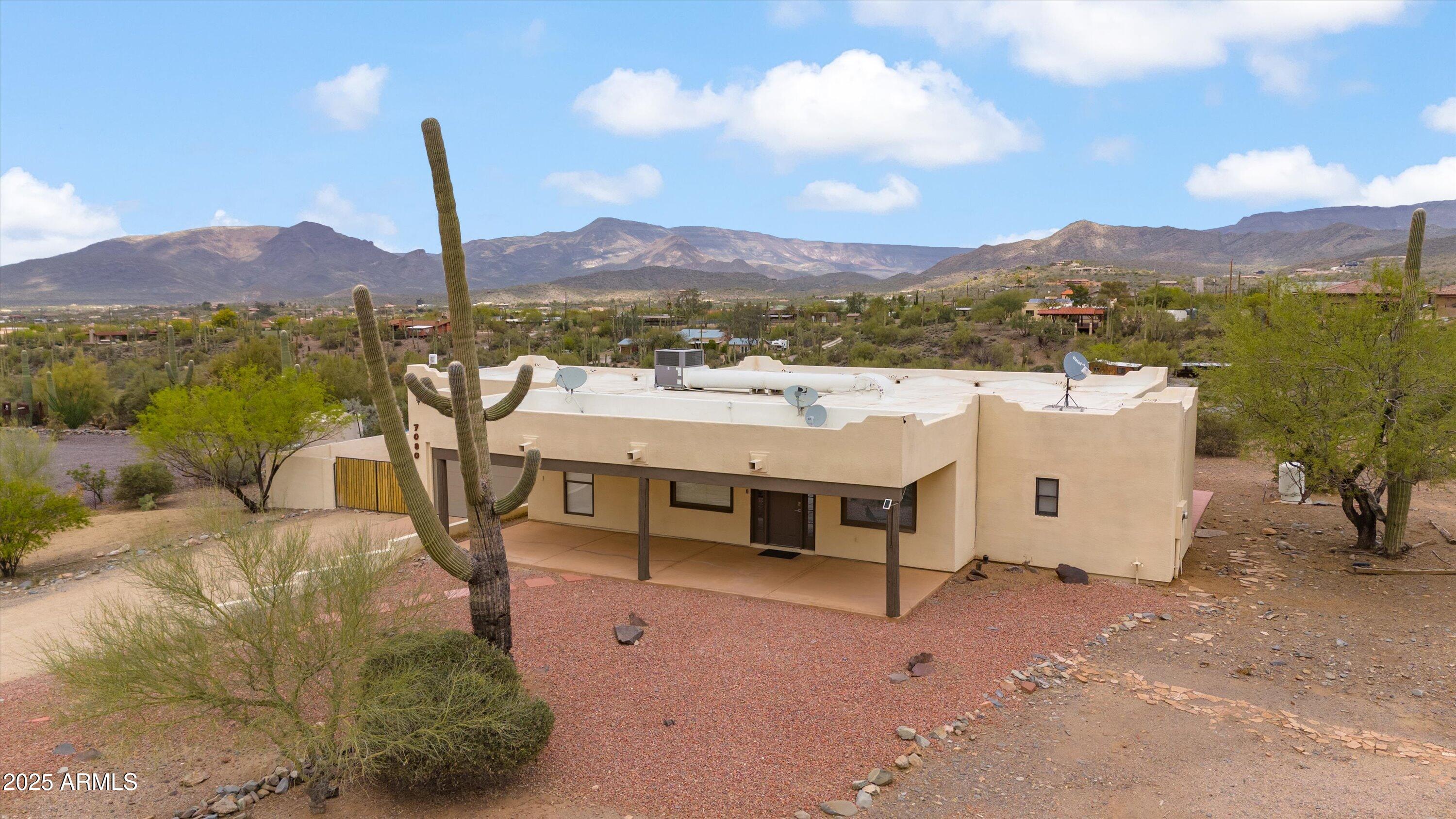 7080 East Arroyo Road Cave Creek, AZ 85331 - Photo 40 of 50 a view of a terrace with a table and chairs