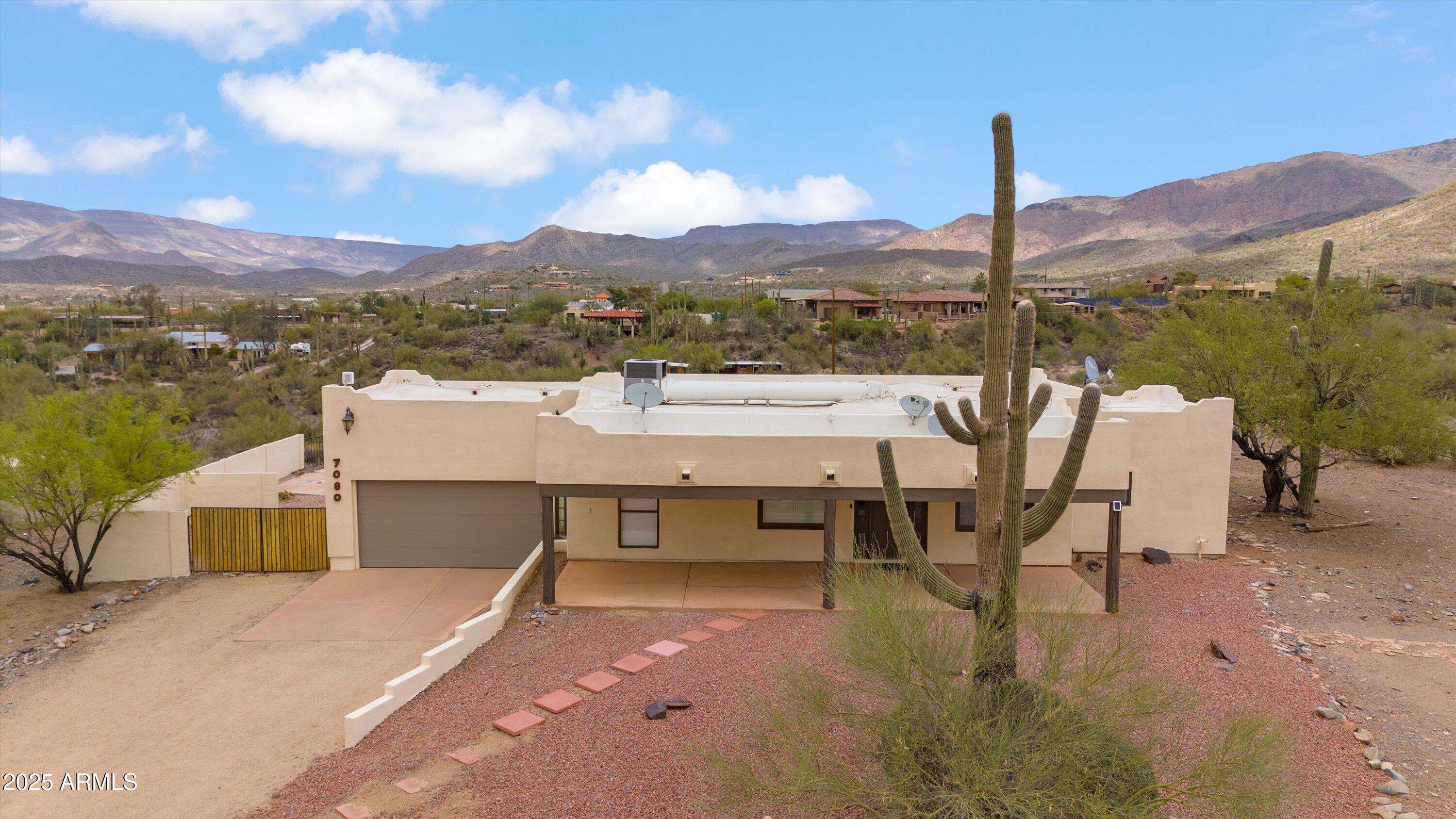 7080 East Arroyo Road Cave Creek, AZ 85331 - Photo 41 of 50 a view of a terrace with a table and chairs