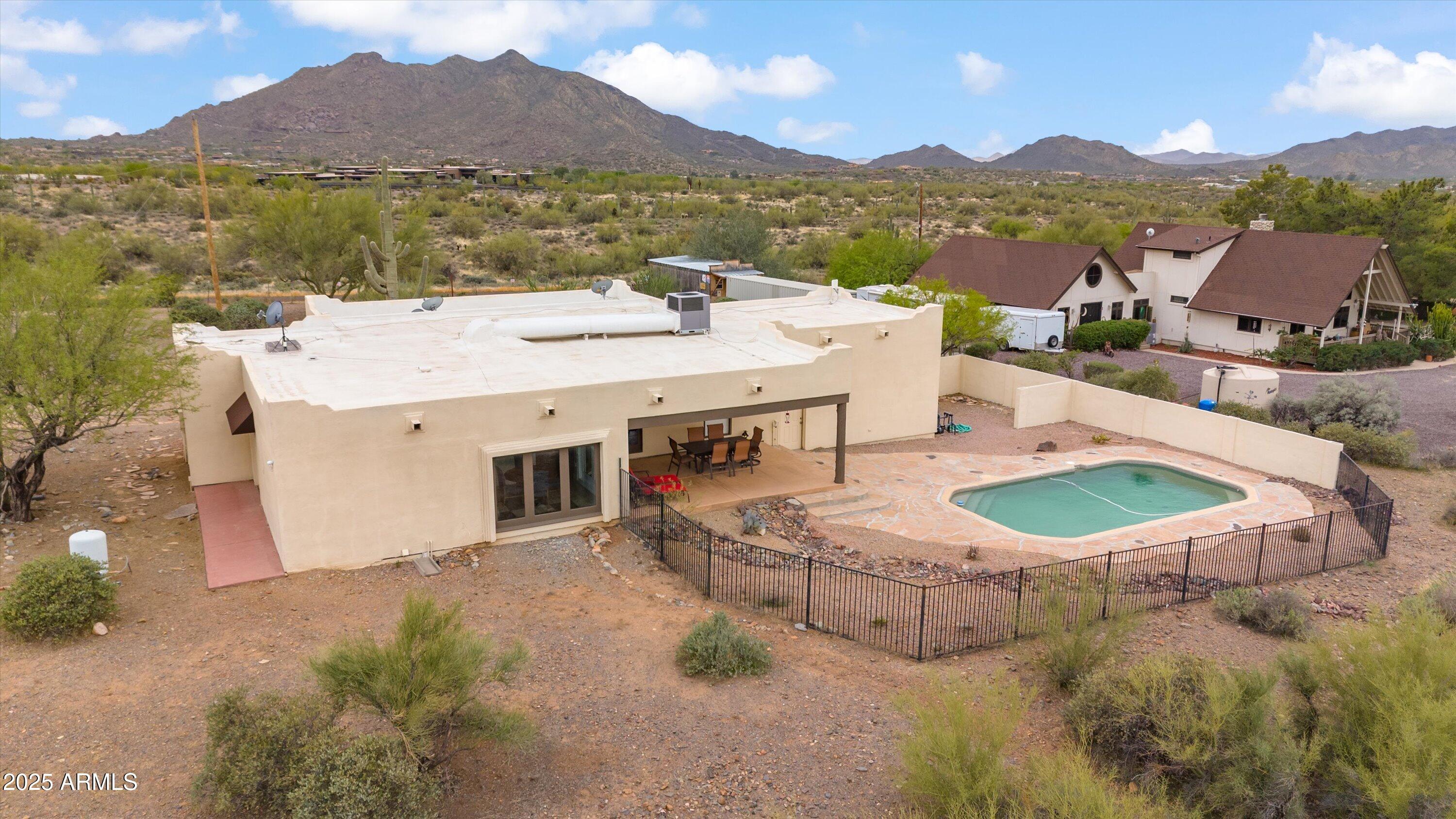 7080 East Arroyo Road Cave Creek, AZ 85331 - Photo 45 of 50 a view of a terrace with a table and chairs
