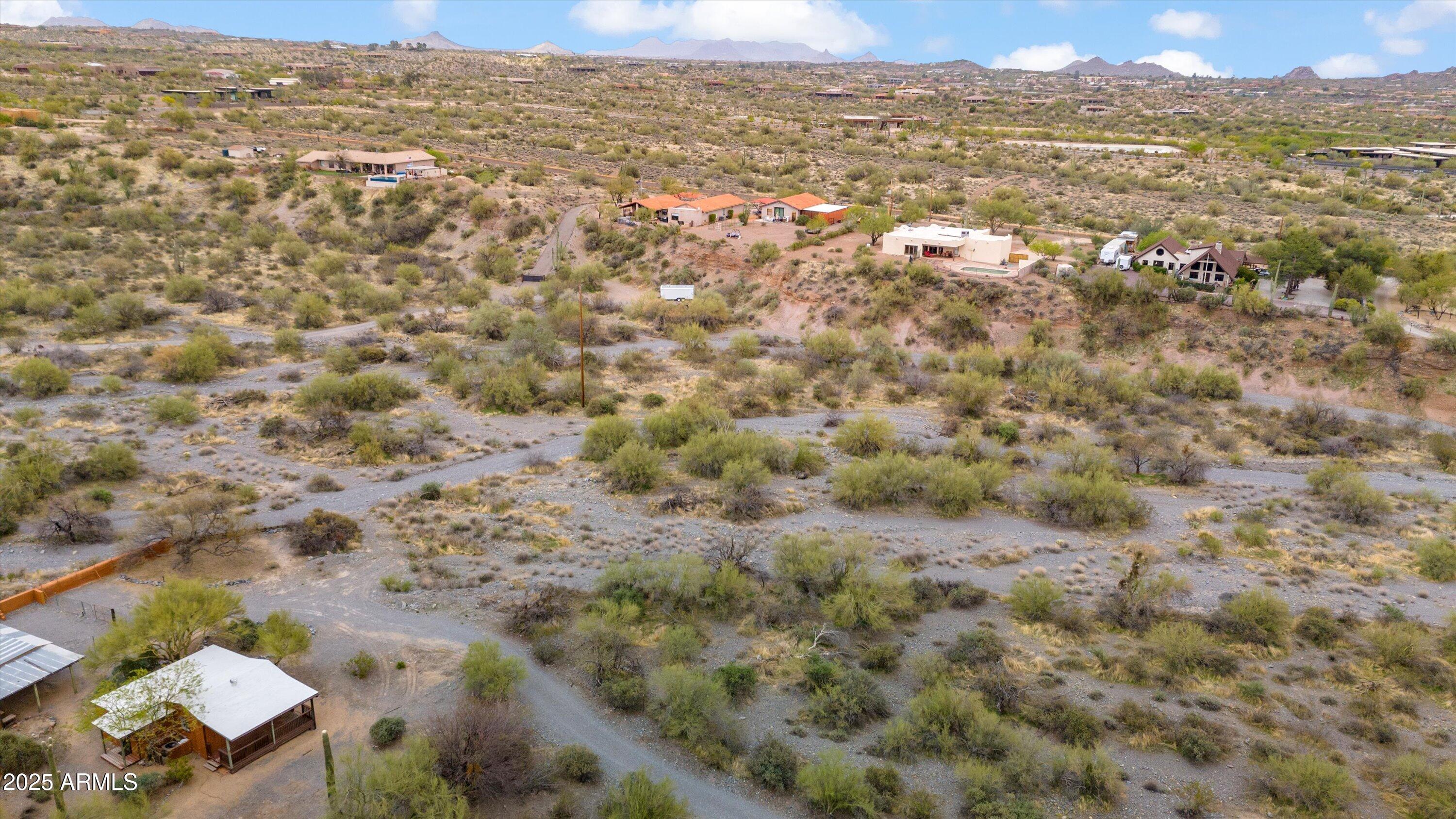 7080 East Arroyo Road Cave Creek, AZ 85331 - Photo 48 of 50 an aerial view of residential houses with outdoor space