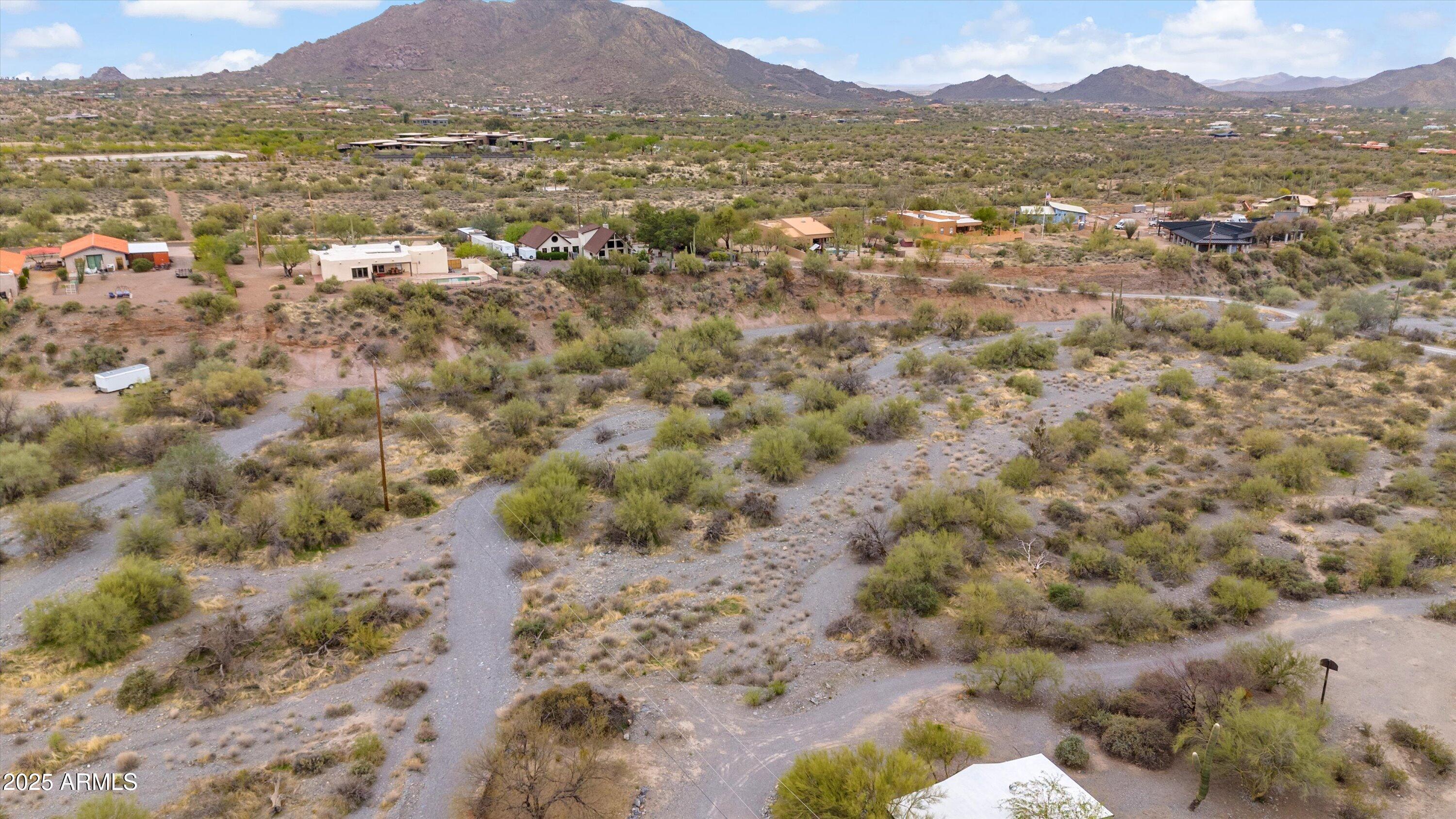 7080 East Arroyo Road Cave Creek, AZ 85331 - Photo 49 of 50 a view of a lake with mountains in the background