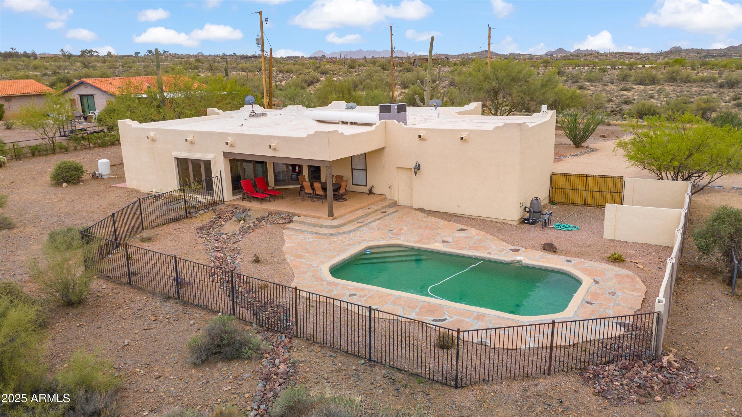 7080 East Arroyo Road Cave Creek, AZ 85331 - Photo 4 of 50 a view of a swimming pool with a patio