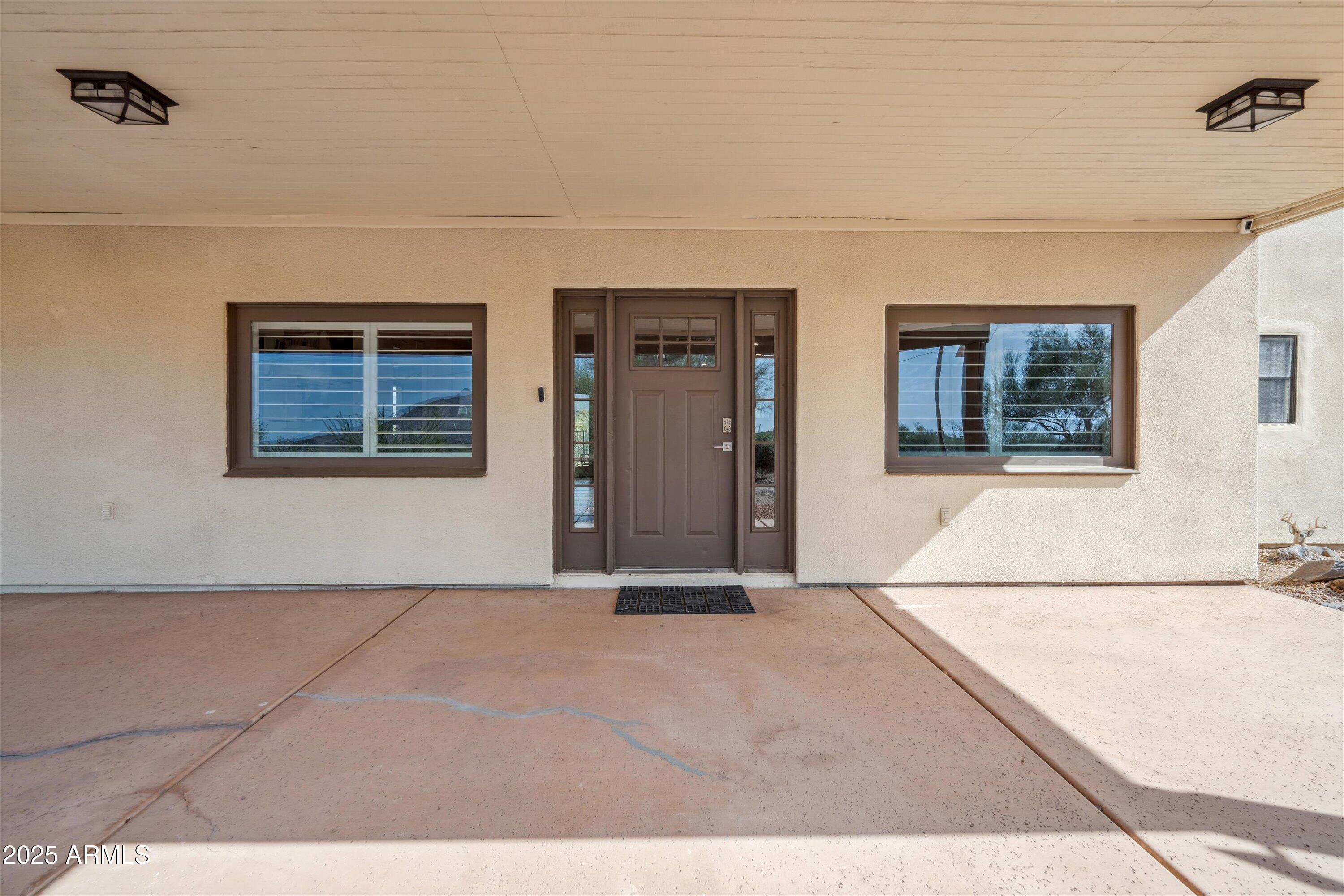 7080 East Arroyo Road Cave Creek, AZ 85331 - Photo 7 of 50 a view of an empty room with a window
