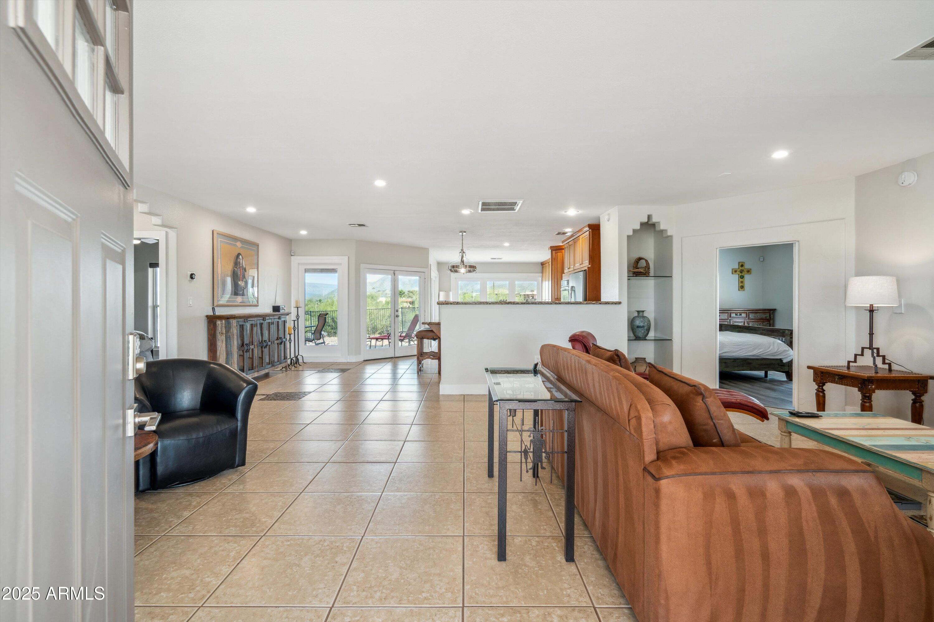 7080 East Arroyo Road Cave Creek, AZ 85331 - Photo 8 of 50 a living room with furniture and a flat screen tv