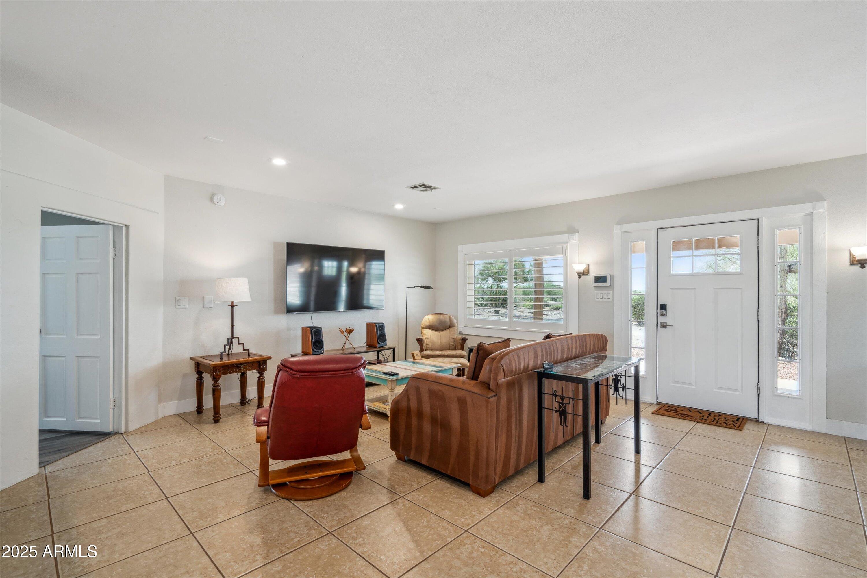 7080 East Arroyo Road Cave Creek, AZ 85331 - Photo 9 of 50 a living room with furniture and a window
