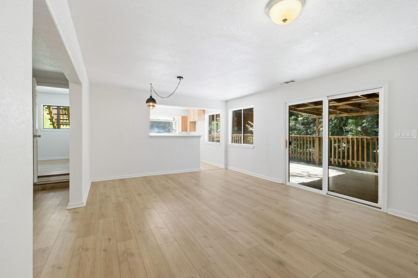 2950 Bear Canyon Road Los Gatos, CA 95033 - Photo 2 of 100 an empty room with wooden floor and windows
