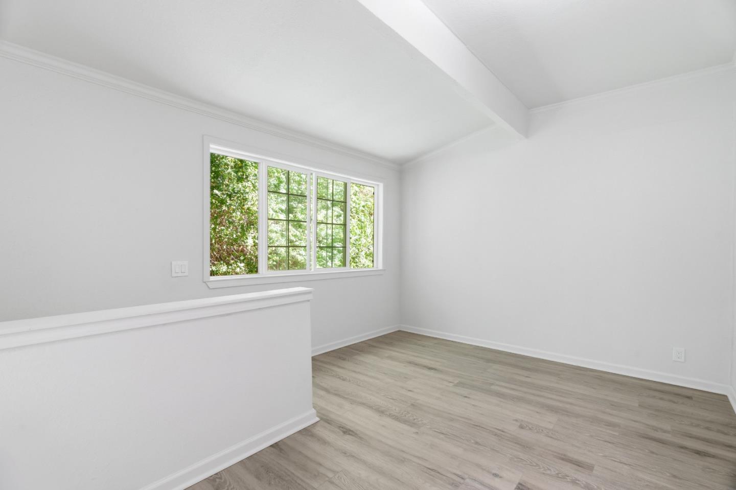 2950 Bear Canyon Road Los Gatos, CA 95033 - Photo 27 of 100 an empty room with wooden floor and windows