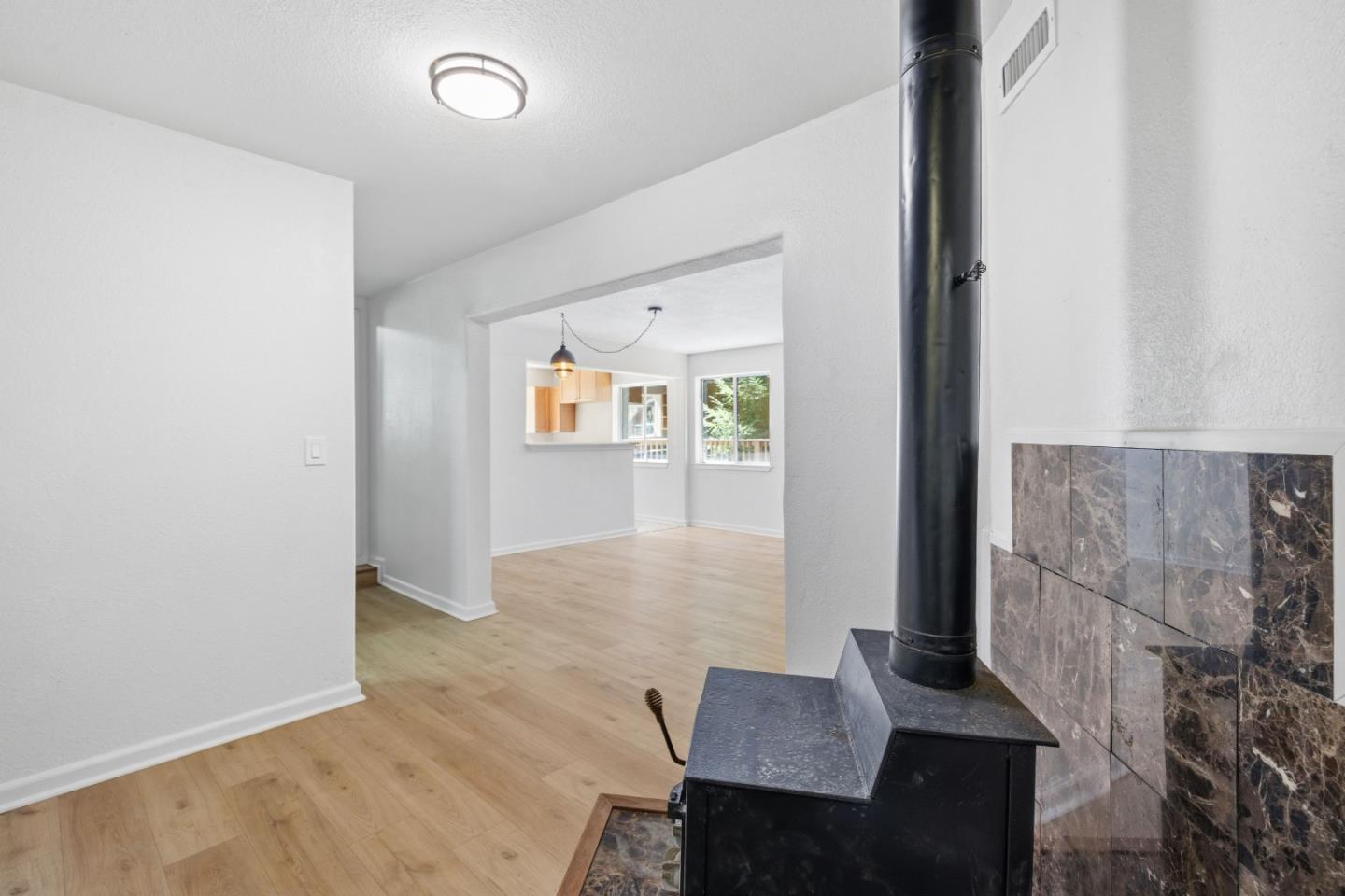 2950 Bear Canyon Road Los Gatos, CA 95033 - Photo 6 of 100 wooden floor in an empty room with a window