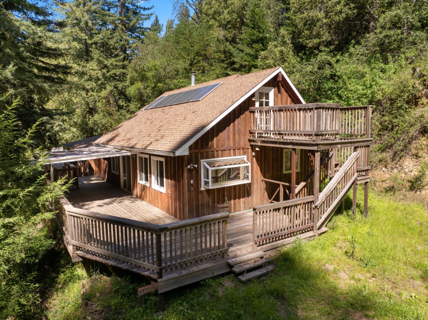 2950 Bear Canyon Road Los Gatos, CA 95033 - Photo 61 of 100 a view of a house with wooden deck front of house