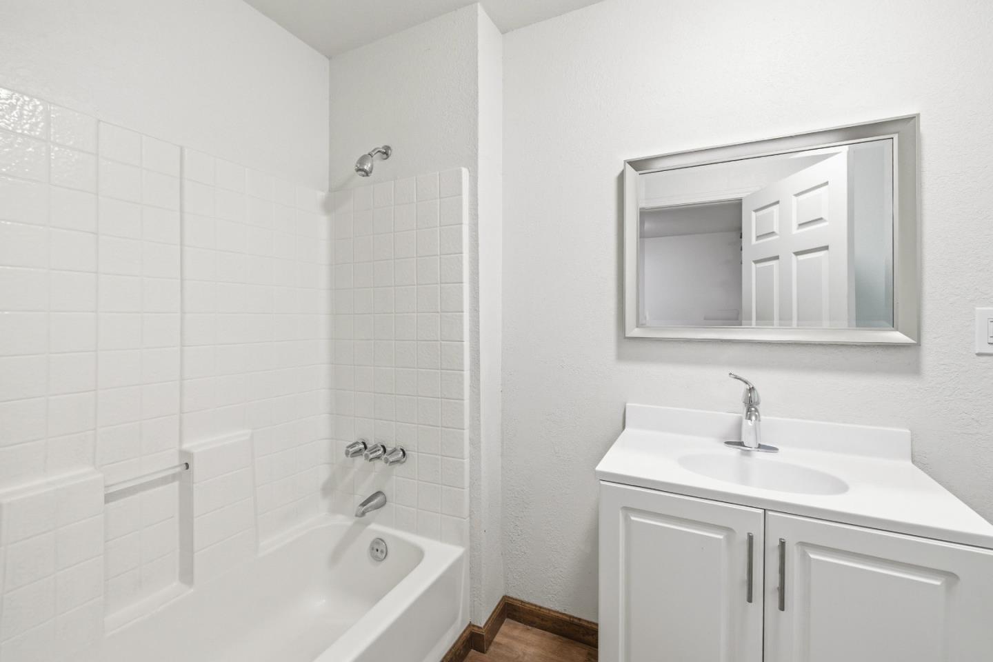 2950 Bear Canyon Road Los Gatos, CA 95033 - Photo 7 of 100 a bathroom with a sink a mirror and a bathtub
