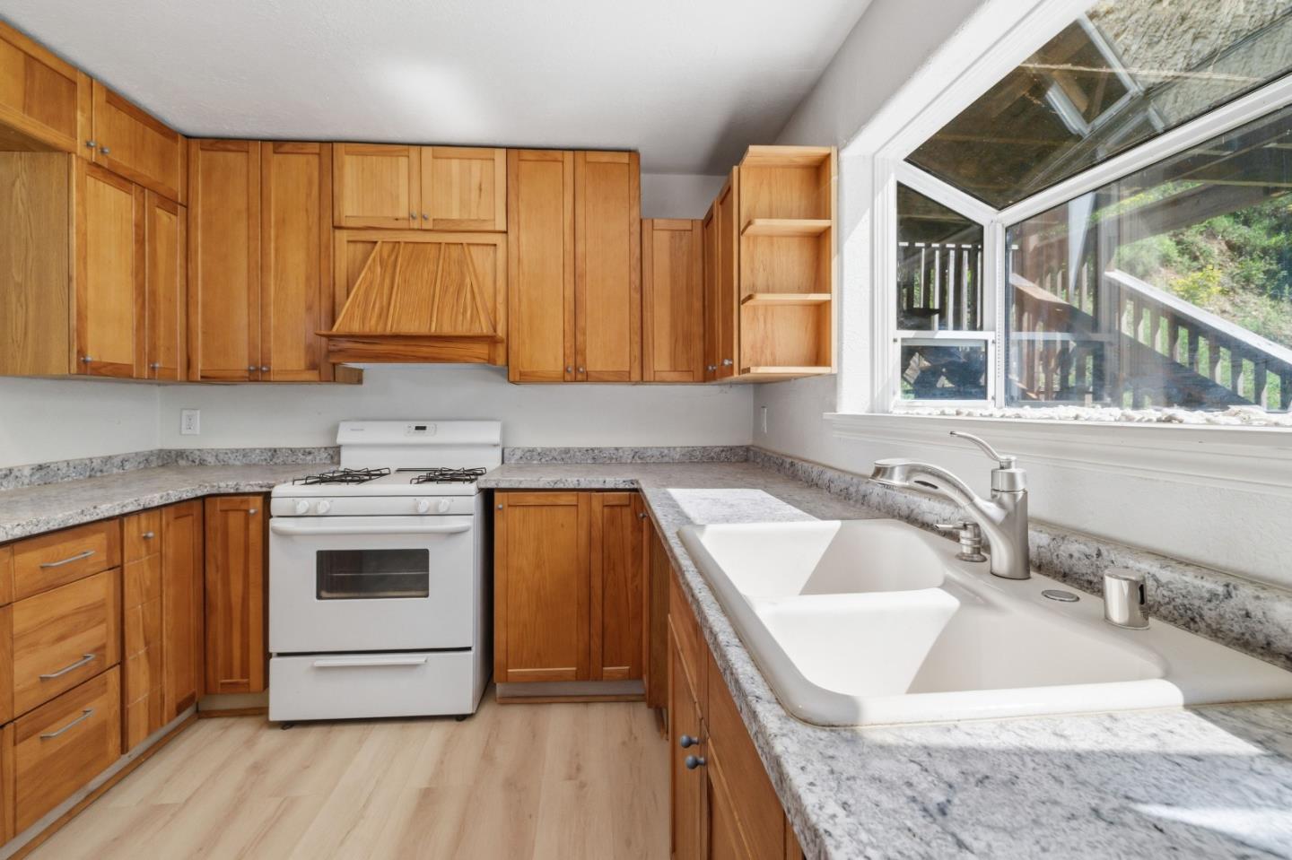 2950 Bear Canyon Road Los Gatos, CA 95033 - Photo 9 of 100 a kitchen with stainless steel appliances granite countertop a sink a stove and a wooden floors