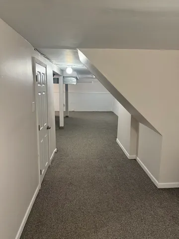 a view of an empty room with stairs