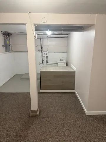 a view with kitchen cabinets and sink