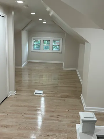 a view of wooden floor and chair in a room