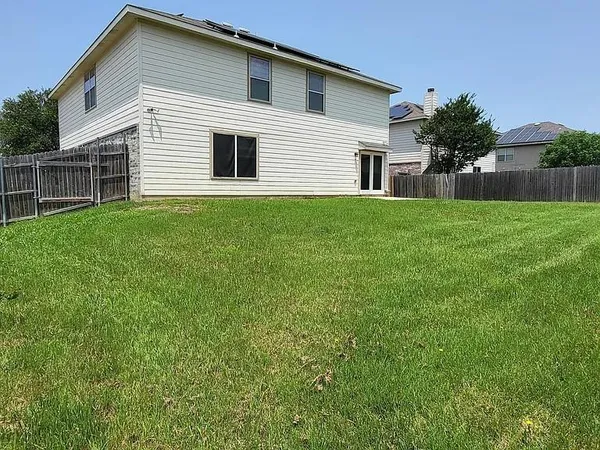 a house view with a garden space