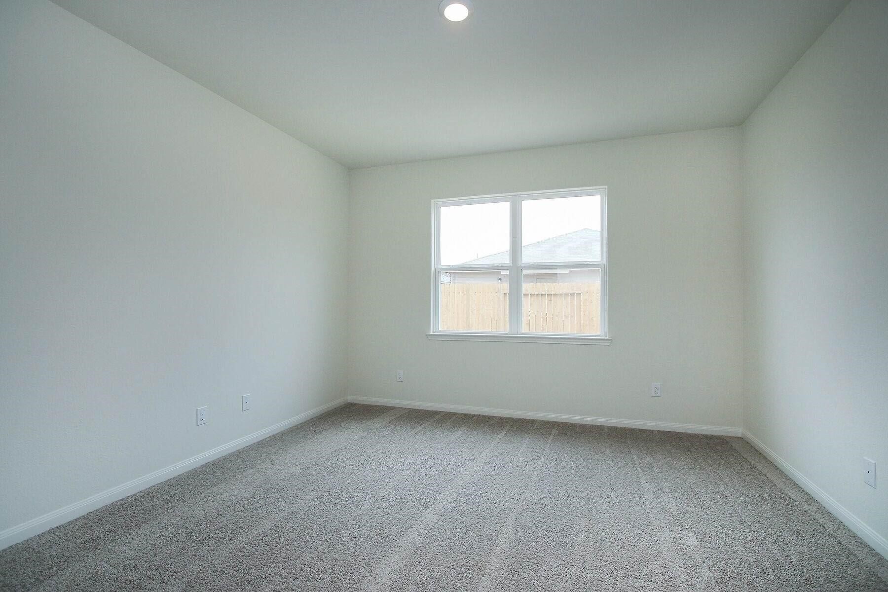 22422 Kennons Way Hockley, TX 77447 - Photo 6 of 11 an empty room with a window