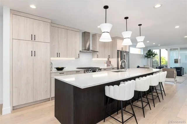 a kitchen with a counter space appliances and cabinets