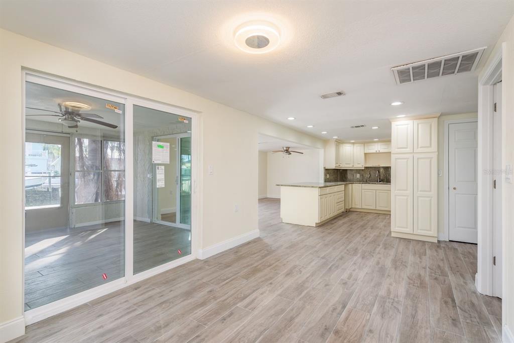 13816 Celida Avenue Hudson, FL 34667 - Photo 12 of 42 a view of a kitchen with wooden floor