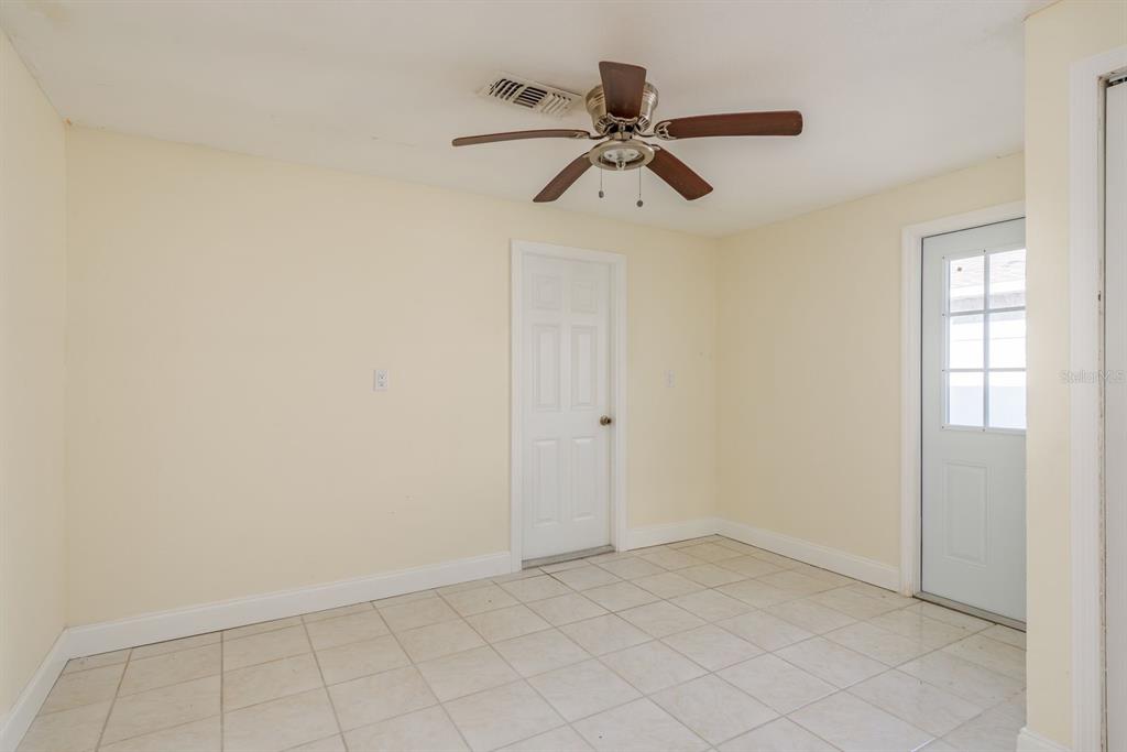 13816 Celida Avenue Hudson, FL 34667 - Photo 28 of 42 a view of a room with a fan and a window