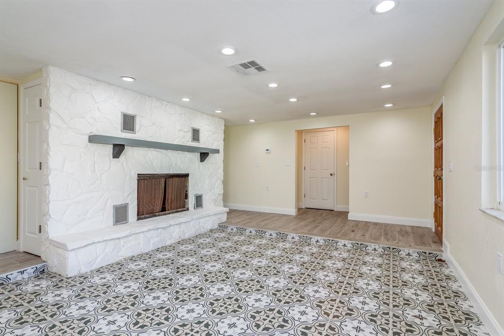 13816 Celida Avenue Hudson, FL 34667 - Photo 3 of 42 a view of a livingroom with a fireplace