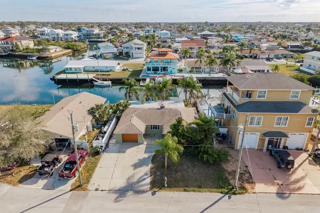 an aerial view of a house with lake view