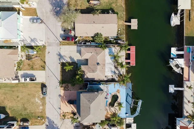 an aerial view of a house with outdoor space