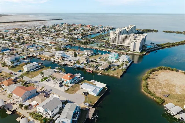 an aerial view of a house with a ocean view