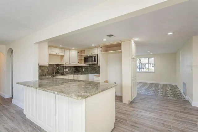 a view of kitchen island kitchen island sink and center island
