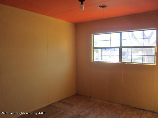 5101 South Bonham Street Amarillo, TX 79110 - Photo 6 of 12 an empty room with a window