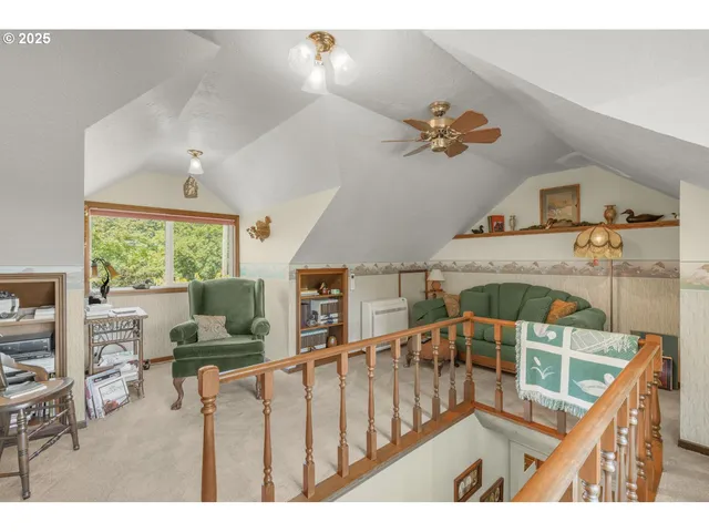 a balcony filled with furniture hardwood floor and a ceiling fan
