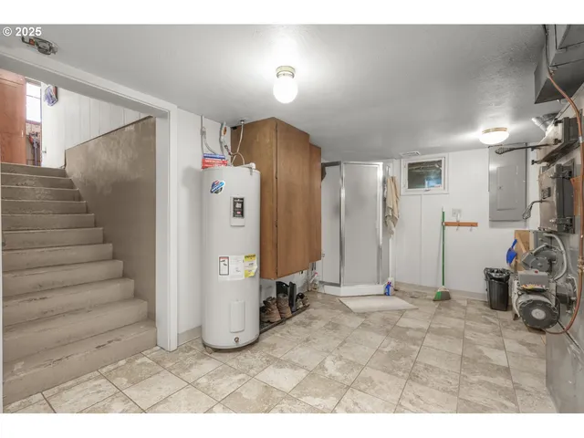 a view of a livingroom with furniture and a window