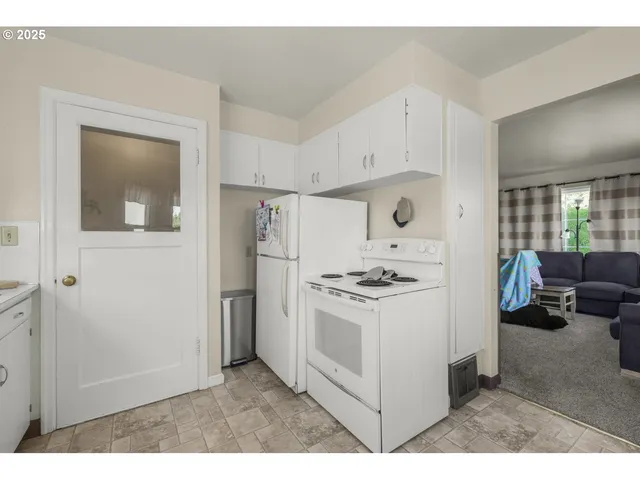 a kitchen with cabinets and appliances