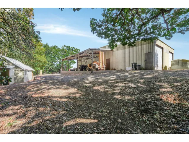 a view of a house with a tree in the background