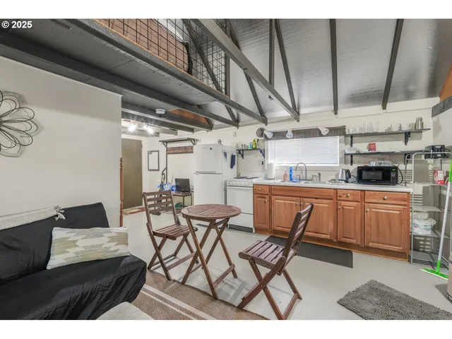 a kitchen with stainless steel appliances kitchen island granite countertop a sink and cabinets