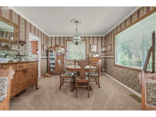 a view of a dining room with furniture window and outside view